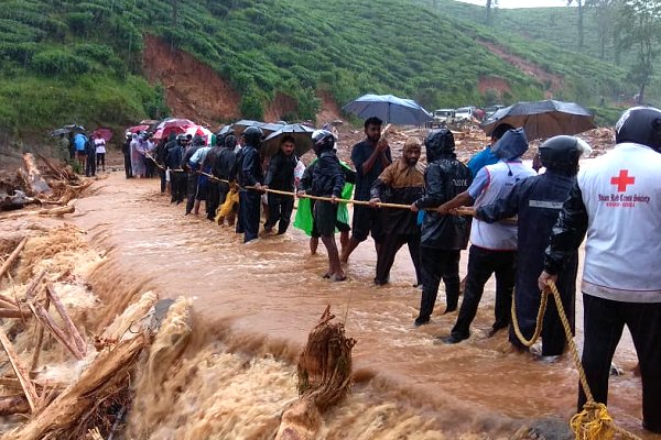 ‘Wading through waist-deep flood waters to reach communities in India’